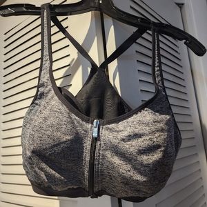 Gently used VSX sports bra with open zip black and gray